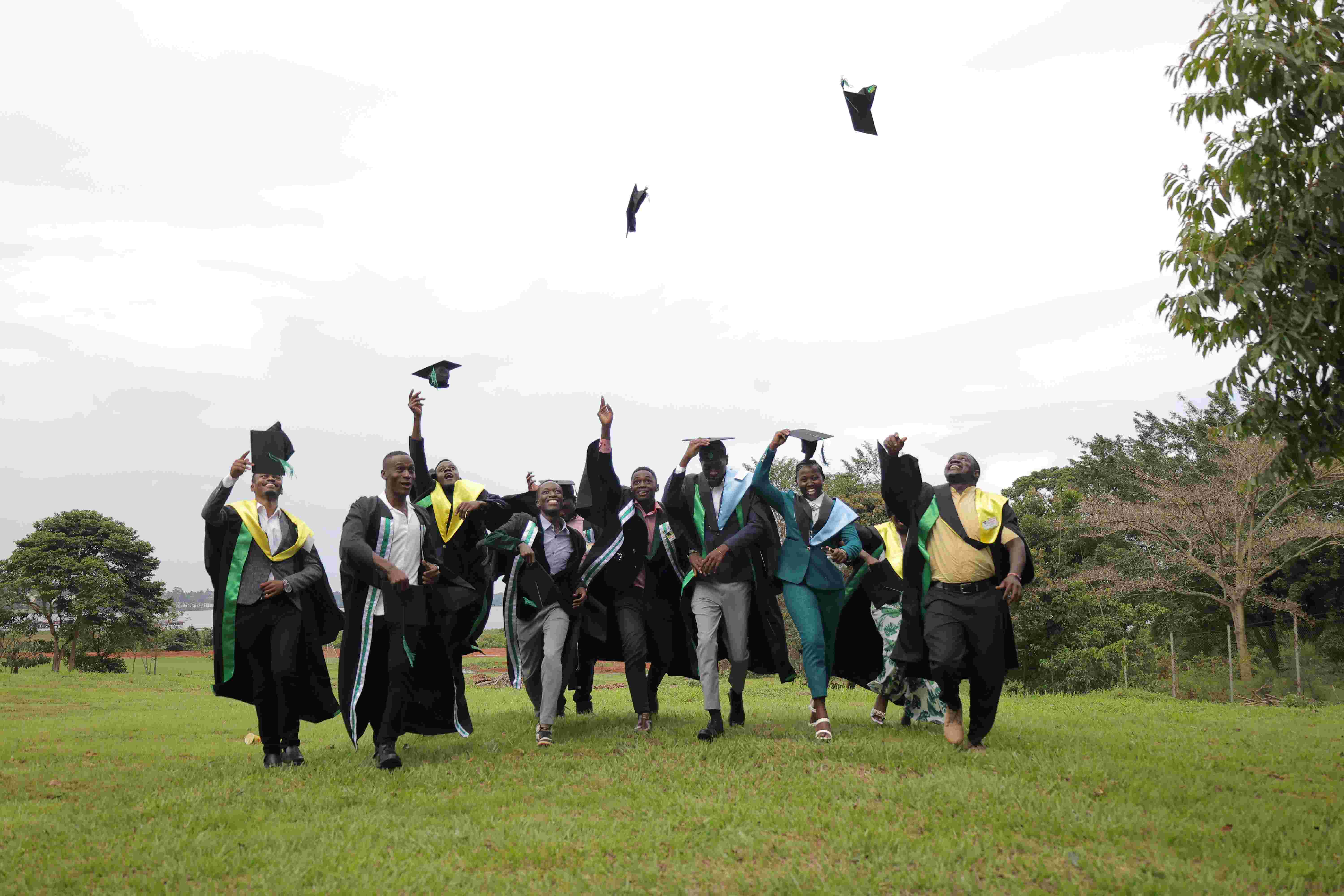 SITM graduates celebrating outdoors